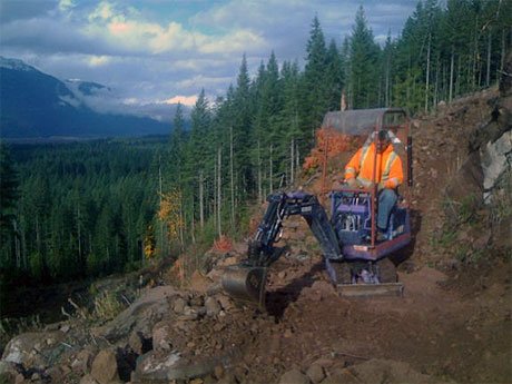 Ed Alder of the Squamish Dirt Bike Association working on the Blindside Connector Trail, part of the network of trails that would be affected by the Skookum Creek project. (Ted Tempany photo)