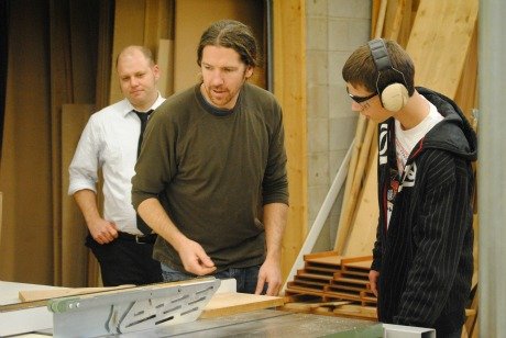 Ryan Massey (left), and Brad Wilmot guide a student in the program.