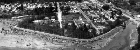 https://www.squamishreporter.com/wp-content/uploads/2014/10/South-dyke-of-Downtown-Squamish-area-seen-in-1966-photo-was-part-of-original-Magee-dyke-system-built-by-Chinese-workers-540x193.jpg