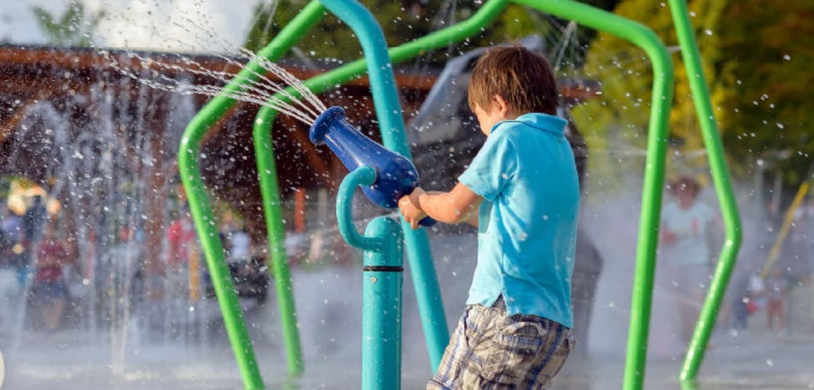 https://www.squamishreporter.com/wp-content/uploads/2024/02/Child-playing-in-splash-park.jpg