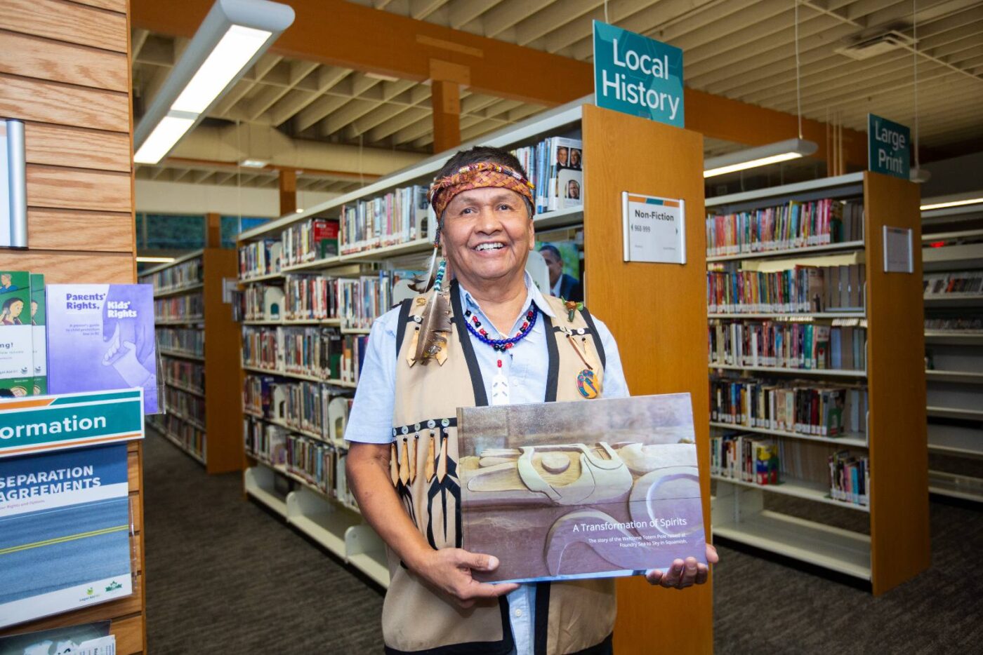 Art Harry at the library with the book.