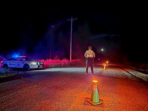 https://www.squamishreporter.com/wp-content/uploads/2025/09/A-BC-Highway-Patrol-officer-waits-at-a-check-stop-in-the-Kootenays-with-a-patrol-car-at-roadside.jpg