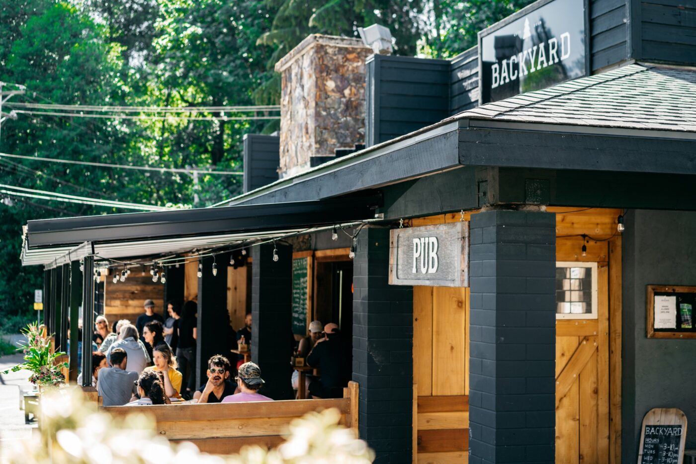 The Backyard pub has become the weekly home of the Valleycliffe dart league, where over 30 players gather every Tuesday night to compete and connect. Photo: Ty Holtan / The Backyard Squamish
