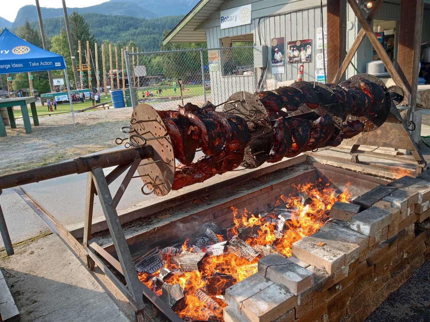 The smell of slow-roasting beef over an open flame has drawn crowds at Squamish Days for over 50 years. Photo: Squamish Rotary Club