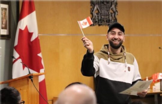 Joudi Safo at his Canadian citizenship ceremony earlier this year, attended by his family and friends.